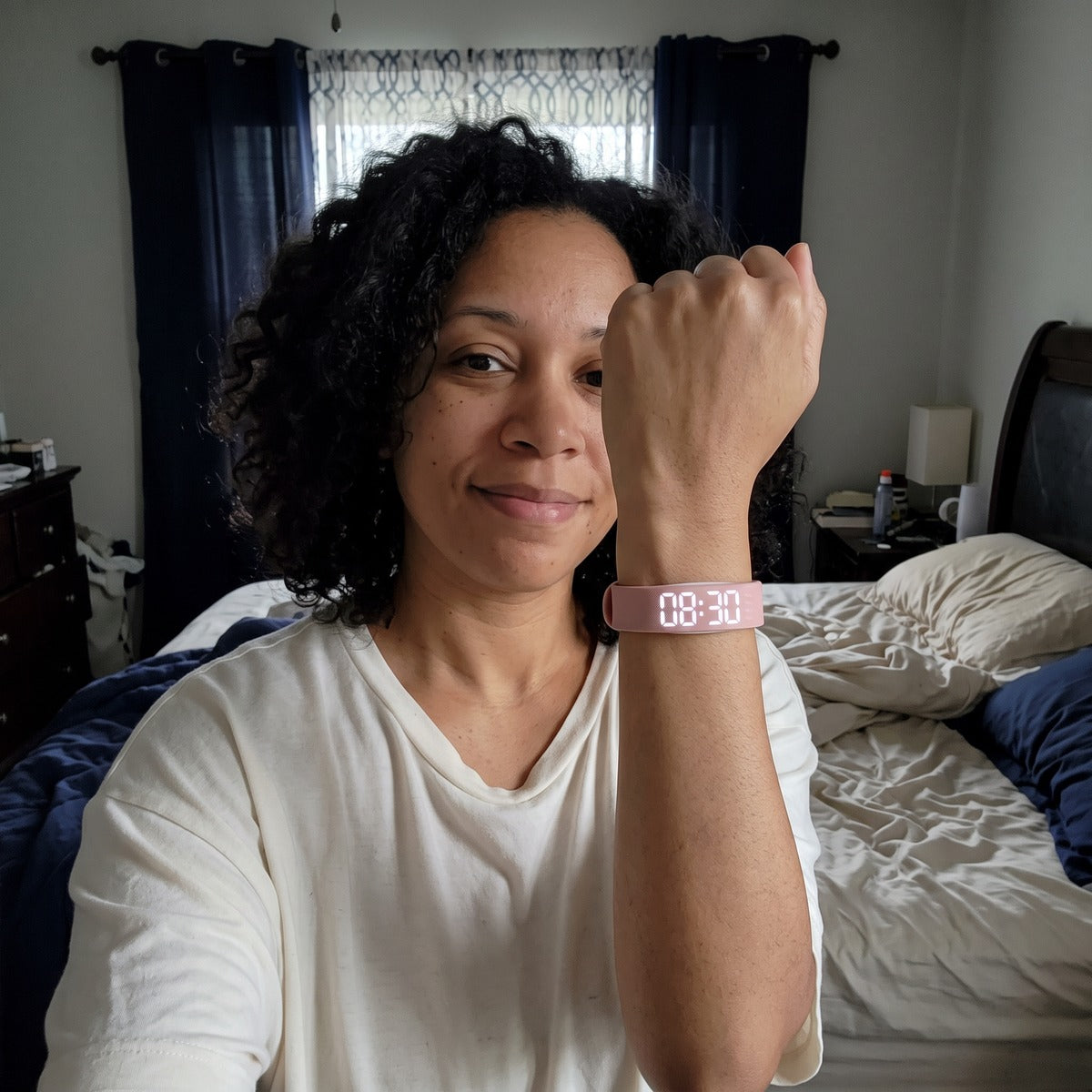 Woman wearing a Pink watch after a night shift